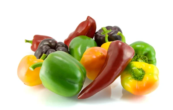 Red, green and violet sweet pepper on a white background — Stock Photo, Image