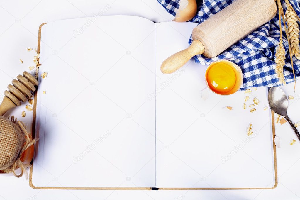 Open notebook and Basic baking ingredients