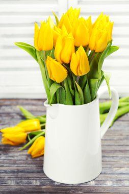 Yellow tulips in a vase clipart
