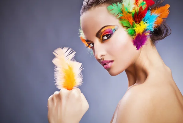 Beautiful young female face with bright fashion multicolored make-up & — 스톡 사진