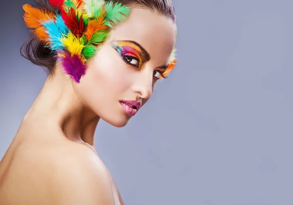 Beautiful young female face with bright fashion multicolored make-up & — Φωτογραφία Αρχείου