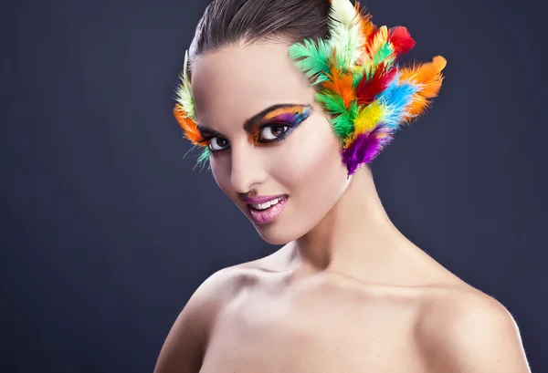 Beautiful young female face with bright fashion multicolored make-up & — 스톡 사진