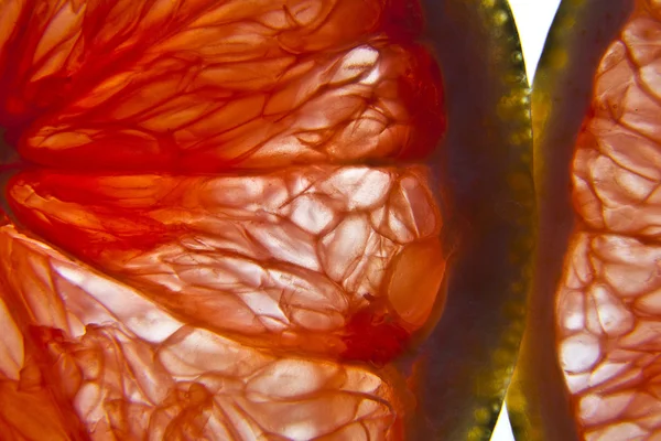 stock image Red grapefruit slice.