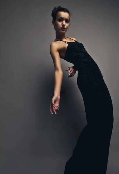 Sexy brunette posing in classical dress. Studio photo. — Stock Photo, Image