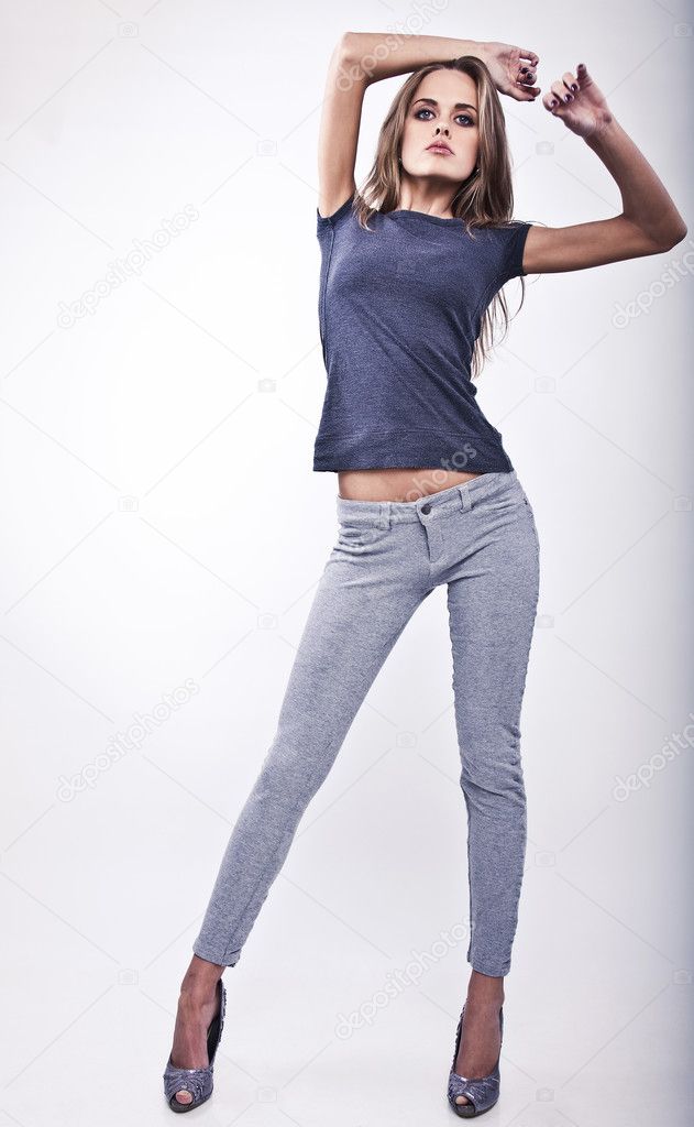 Young Attractive Woman Pose In Casual Gray Clothing Stock Photo Image By C Innervision