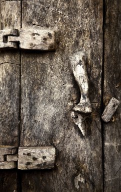 Old wooden door with ornaments In Bali. clipart