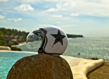 Motorcycle helmet over nature background clipart