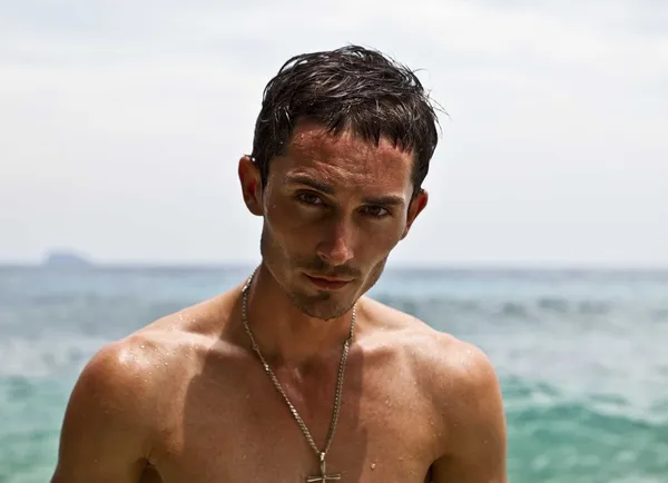 stock image Sexy caucasian fit man posing in a beach