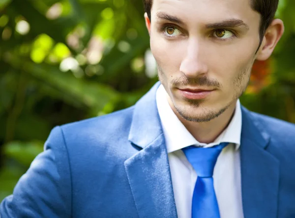 Portrait of a good looking beautiful young man in costume outdoors. — Stock Photo, Image