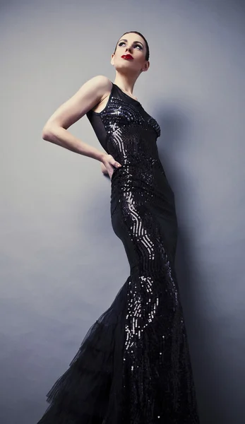 Beautiful woman on black classical dress pose in studio. — Stock Photo, Image