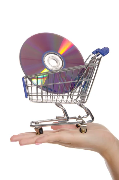 Optické disky v nákupním vozíku na dlani — Stock fotografie