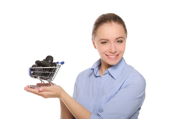 Black stones in shopping trolley on the women palm — Stock Photo, Image