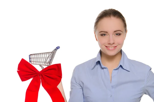 Woman with red bow on the shopping cart — Stock Photo, Image