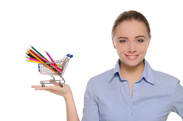 Kvinna med färgpennor i shopping vagn — Stockfoto