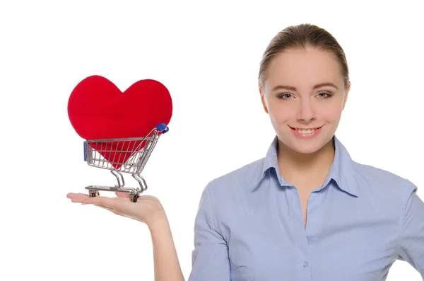 Mulher com símbolo de coração no carrinho de compras — Fotografia de Stock