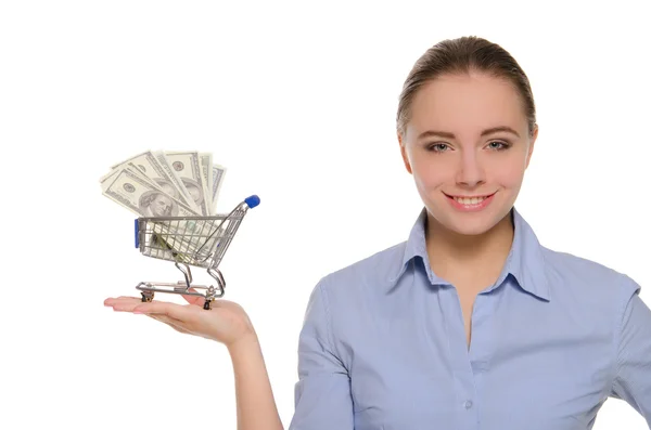 Vrouw met dollarbiljetten in winkelwagentje — Stockfoto