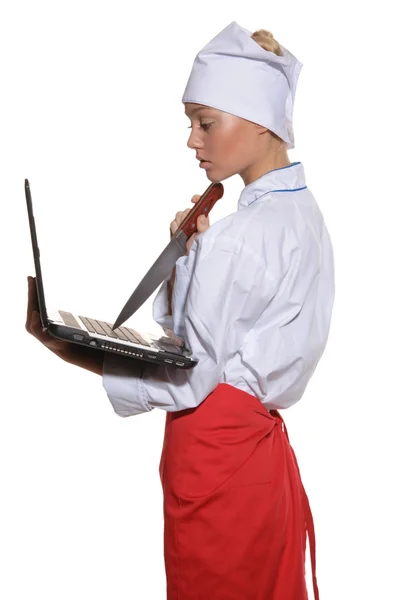 Happy woman-cook with laptop and knife — Stock Photo, Image
