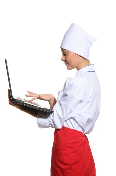 Happy woman-cook with laptop — Stock Photo, Image