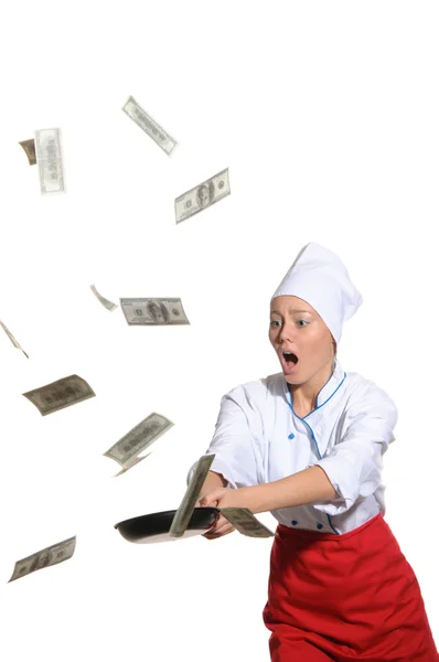 Surprised woman-cook frying pan catches money — Stock Photo, Image