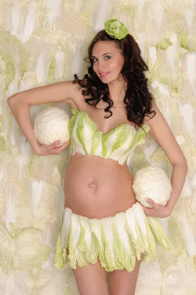 Pregnant woman in lingerie from lettuce — Stock Photo, Image