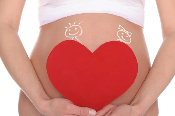 Barriga grávida com imagem de crianças e coração — Fotografia de Stock