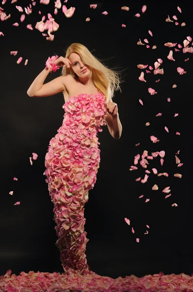 Beautiful woman in dress of rose petals — Stock Photo, Image