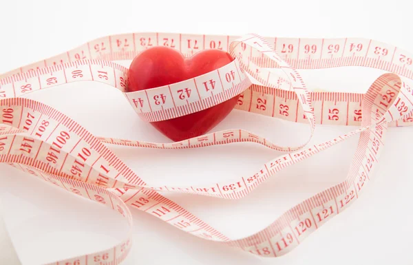 stock image Red heart surrounded by a tape measure