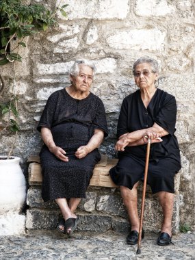 Typical old ladies in Pirgi of Chios island - Greece clipart