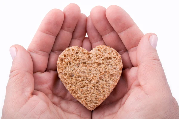 En bit bröd erbjuds med kärlek - isolerad på vit — Stockfoto