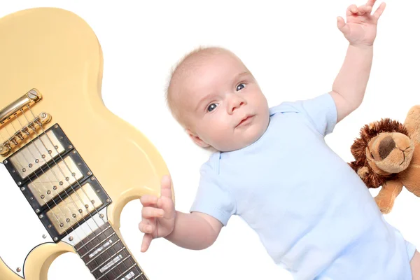 Baby boy laying with guitar — Stock Photo, Image