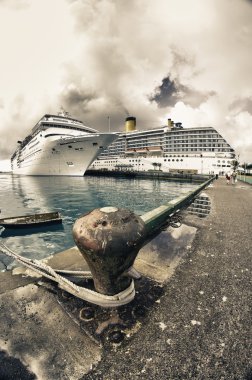 Anchored Cruise Ship in a Port of Call clipart