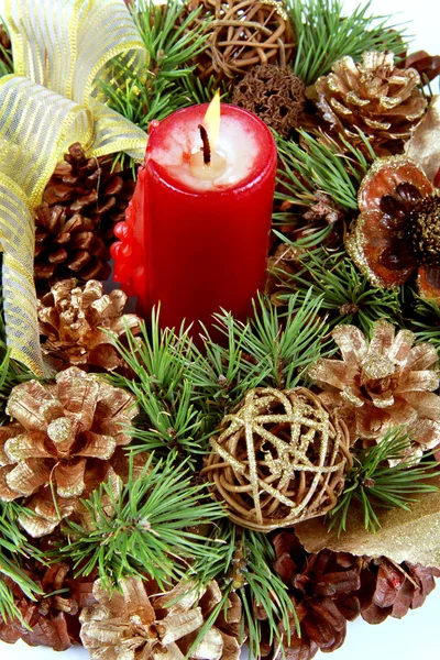 Candle in the Christmas fir-cone wreath — Stock Photo, Image