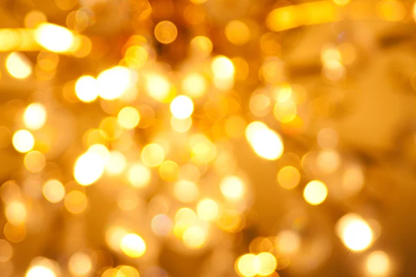 Złotym tle światła Bożego Narodzenia — Zdjęcie stockowe
