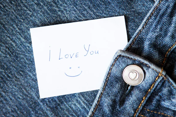Niebieskie dżinsy z ręką drukowane karty "Kocham cię" — Zdjęcie stockowe