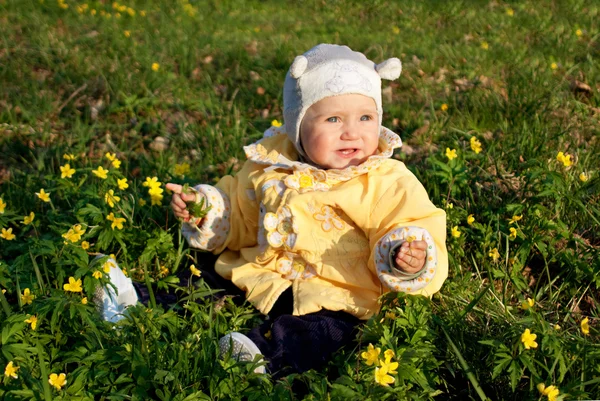 Stock image Outdoor portrait of a cute little baby in the grass