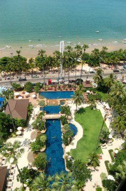 Swimming pool at the beach of popular hotel, Pattaya, Thailand clipart