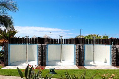 Outdoor showers near swimming pool and beach, Tenerife island, S clipart