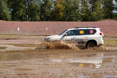 KIEV - SEPTEMBER 11: New generation of Toyota Prado during off-r clipart