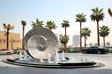 DUBAI, UAE - AUGUST 27: The fountains and waiting area of the Ad clipart