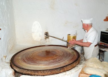 RETHYMNO, CRETE - MAY 16: The senior confectioner prepares tradi clipart