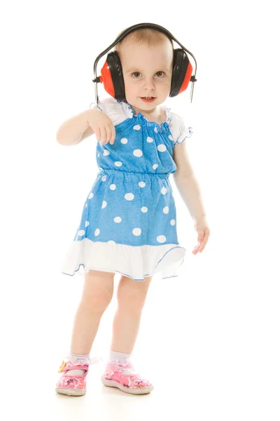 Malá holčička v sluchátka — Stock fotografie