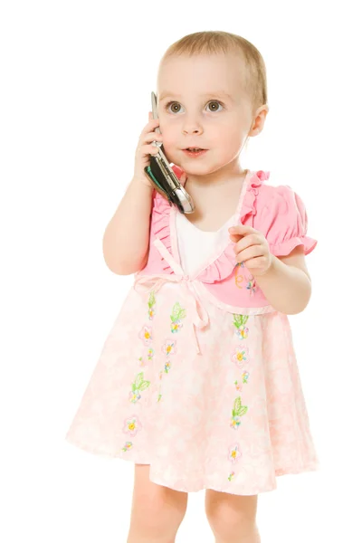 Menina falando ao telefone em um vestido rosa — Fotografia de Stock