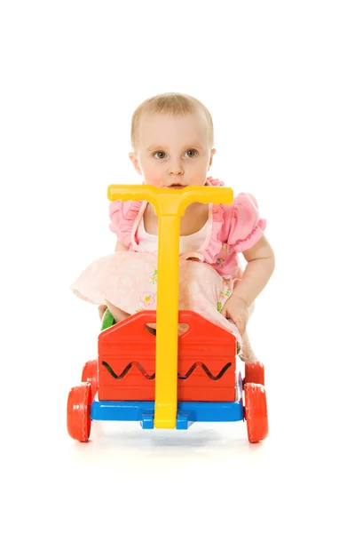Baby sitting on a trolley — Stock Photo, Image