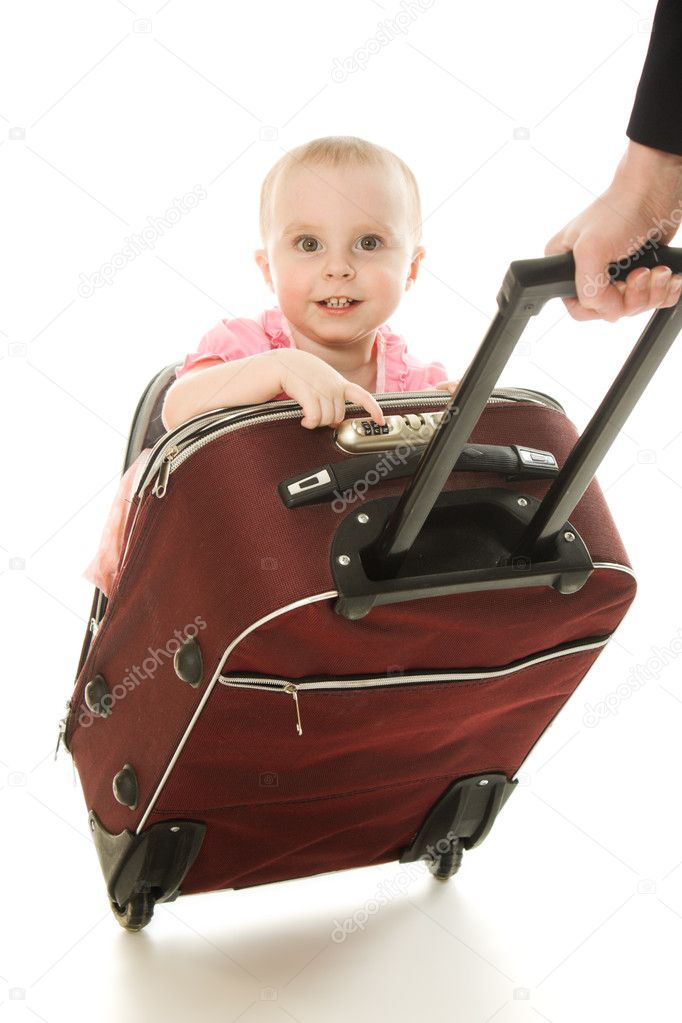 Beautiful baby in suitcase isolated