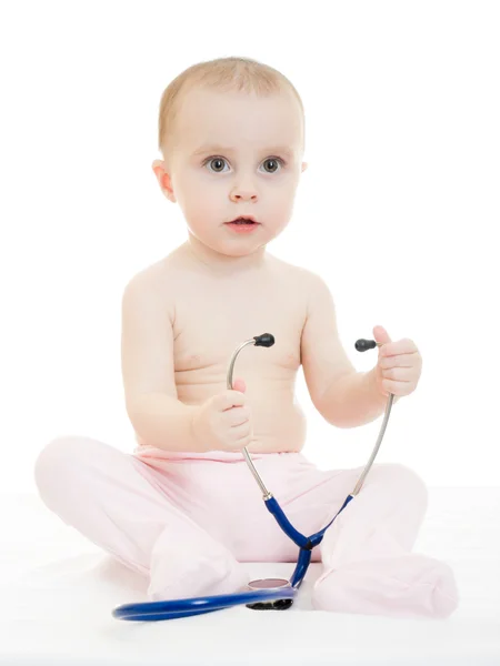 Glückliches Baby mit Stethoskop auf weißem Hintergrund. — Stockfoto