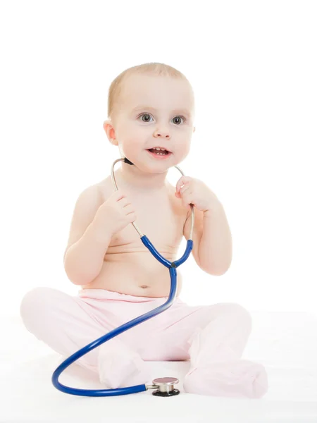 Gelukkig baby met stethoscoop op witte achtergrond. — Stockfoto