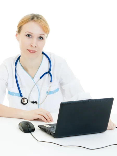 A woman doctor consultant with a laptop on a white background. — Stock Photo, Image