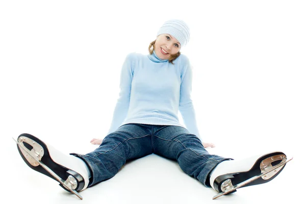 Een meisje met schaatsen op witte achtergrond. Stockafbeelding