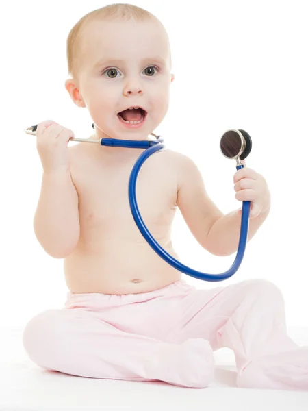Happy baby with stethoscope on white background. Stock Picture