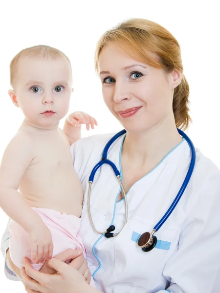 Ärztin mit Baby im Arm auf weißem Hintergrund. Stockbild